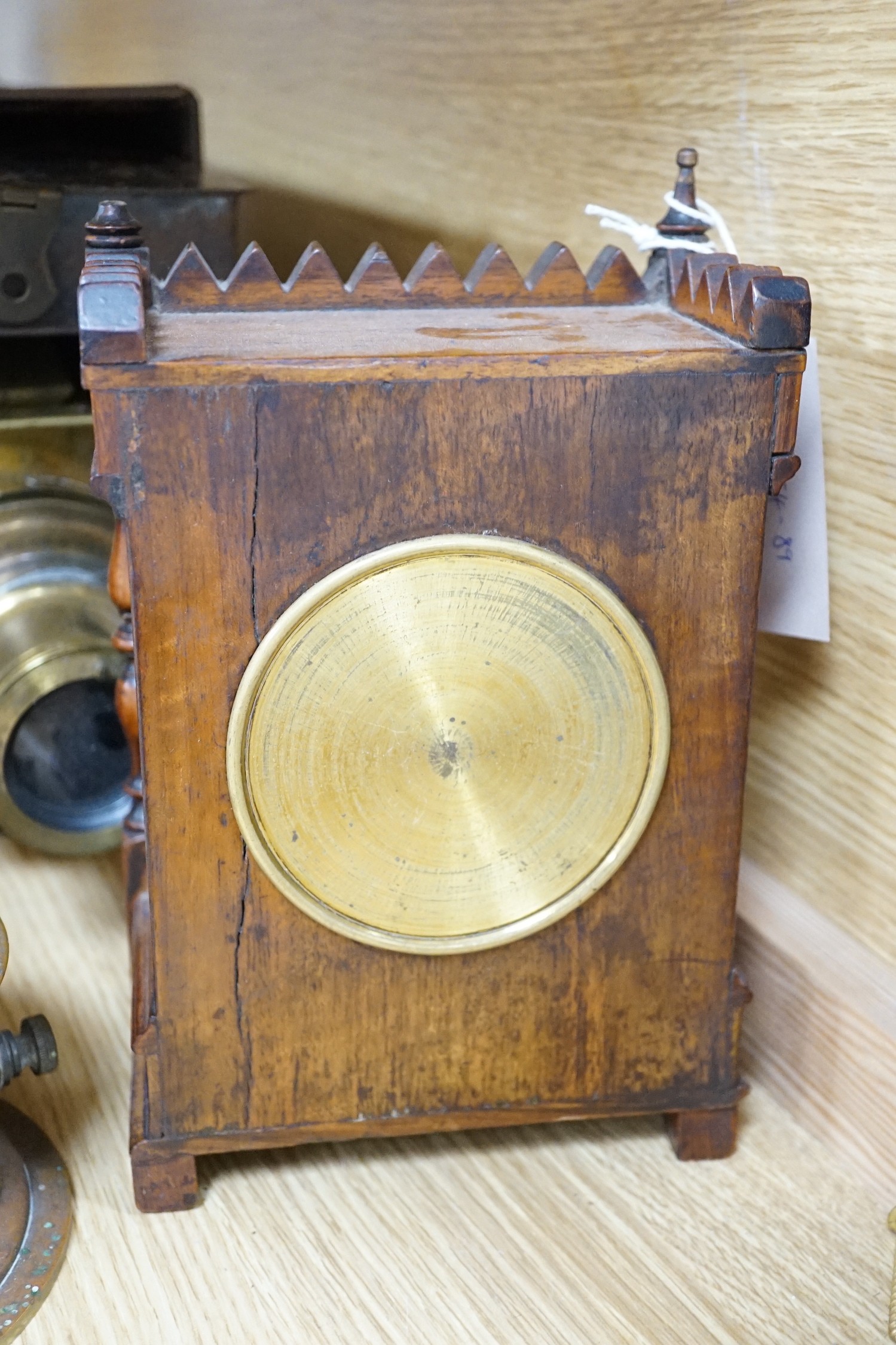 A cased tinplate and pressed brass Magic Lantern, Case 46 cm long, A French walnut cased mantel timepiece, with key, 23cm, and a brass cased Milli-Amps scale